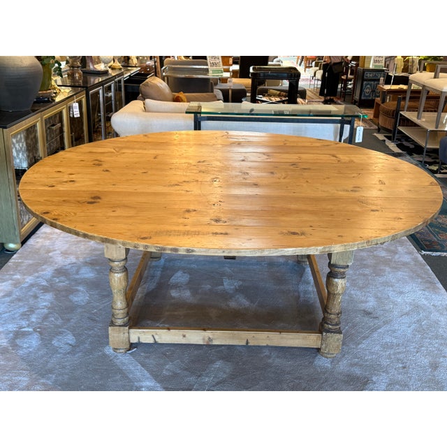 Design Plus Gallery presents a Display or Dining Room Table of Irish Pine Wood. The table offers a wide planked surface...