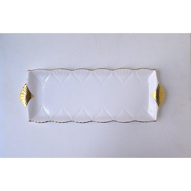 An English white and gold porcelain tray with gold fan or seashell design, Art Deco design, circa early to mid-20th...