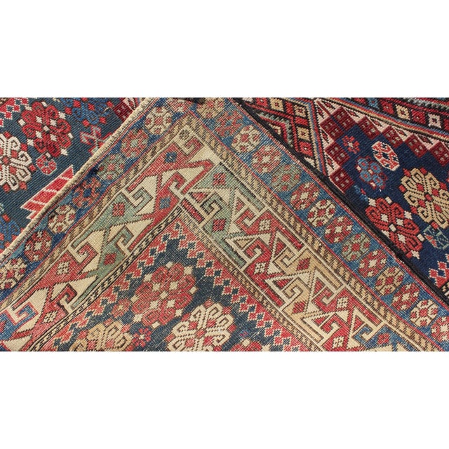 Textile Antique Kazak Tri- Medallion Rug With Multi Coors and Indigo Background For Sale - Image 7 of 8