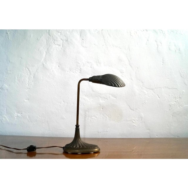 Original Art Nouveau antique desk lamp for sale. Made of solid brass, and quite a beautiful lamp to decorate. Can be used...