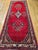 "Vintage Persian Hamadan Wide Runner, a truly magnificent hand-knotted piece. The runner features a brilliant red color...