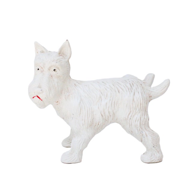 Whimsical Terrier Scottie dog made of cast iron. Center seam is split however, he stands firm. Shipping: We promptly ship...