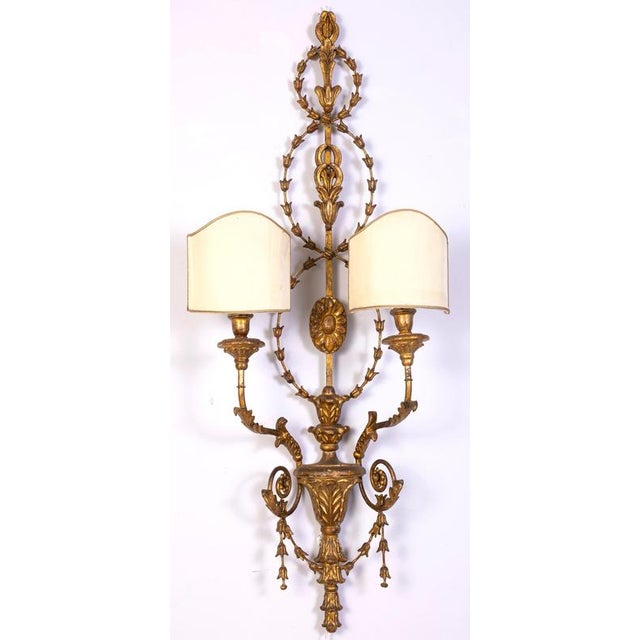 Elegant pair of 19th century finely carved and gilt - wood Sconces with two candle arms, Roma, 1840. Original gilding in...