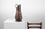 A striking French copper coal bucket, crafted around 1900, now serving beautifully as a decorative umbrella stand. The...