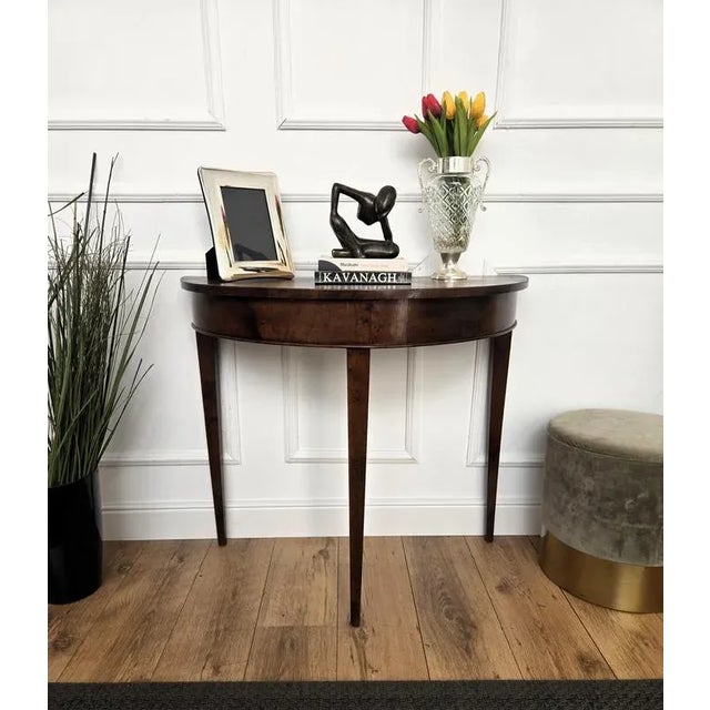 Very elegant and refined Italian Mid-Century Modern design console side table. Standing on three typically shaped wooden...