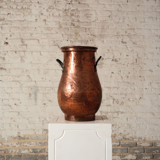 Add striking Old World character to your space with this late 18th century French copper pot, a tall and beautifully hand-...