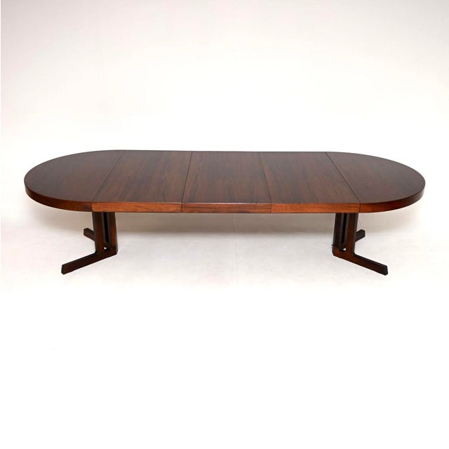 A stunning Danish vintage dining table by Johannes Andersen. It was made in Denmark by Hans Bech, and dates from the...
