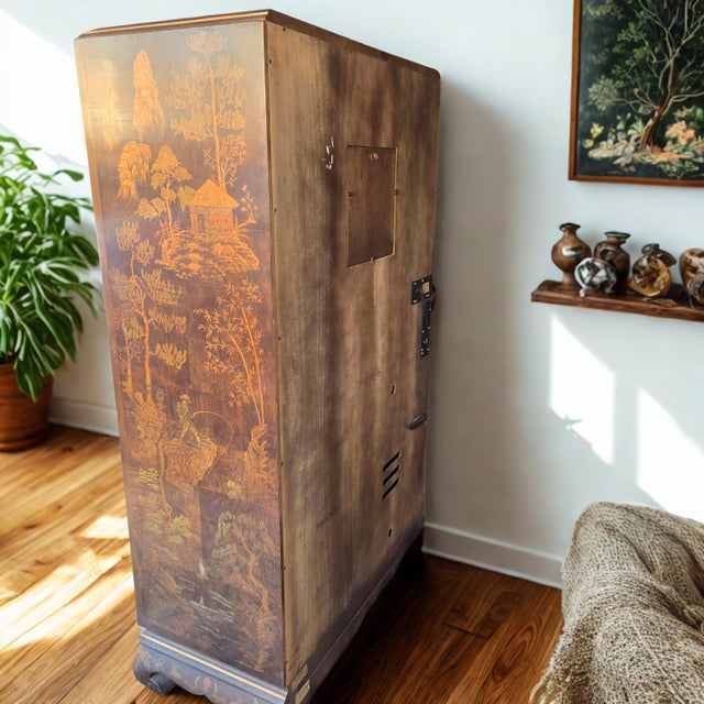 This vintage Henredon Folio 10 Chinoiserie Armoire is a beautifully crafted statement piece. The piece features a Ming...