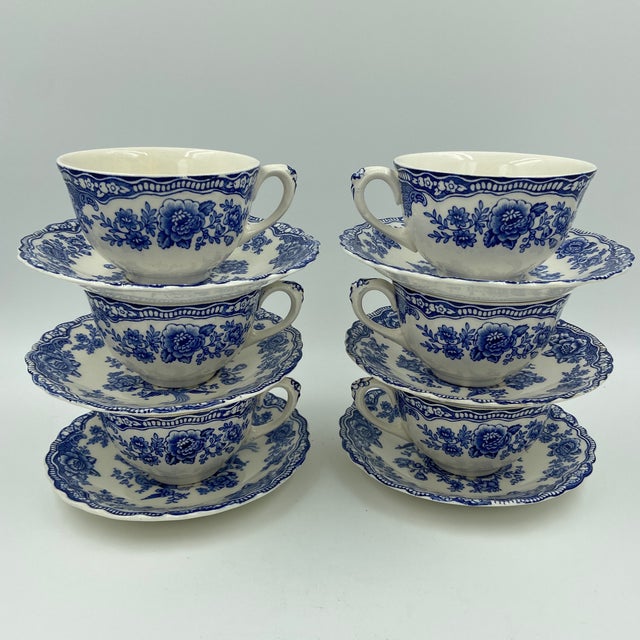 A charming set of six vintage Crown Ducal "Bristol" teacups and matching saucers, beautifully decorated in the classic...