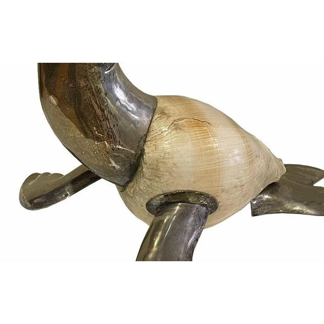 Italian sculpture Seal began 20th Century in silver metal and shell, eyes in colored glass. Slight wear. Dim.: 39 x 50 cm...