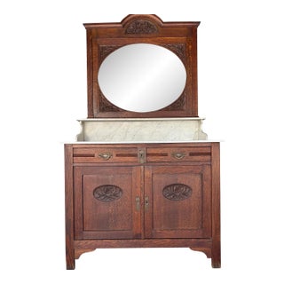 Antique Oak Washstand / Bathroom Vanity With a Marble Top, Oval Beveled Mirror, and Floral Carvings For Sale