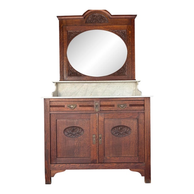 Antique Oak Washstand / Bathroom Vanity With a Marble Top, Oval Beveled Mirror, and Floral Carvings For Sale