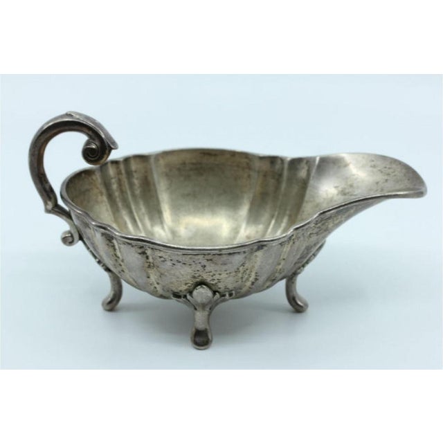 Silver Gravy Boat with Friezes and Feet, in Very Good conditions. Designed before 1890 This piece has an attribution mark,...
