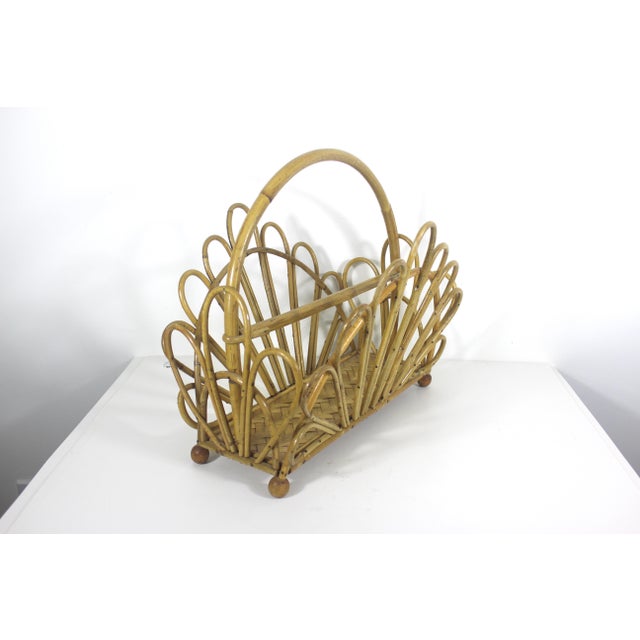 Very boho chic bent bamboo magazine rack with a fan shape and a woven base. Could be used for so many other things -...