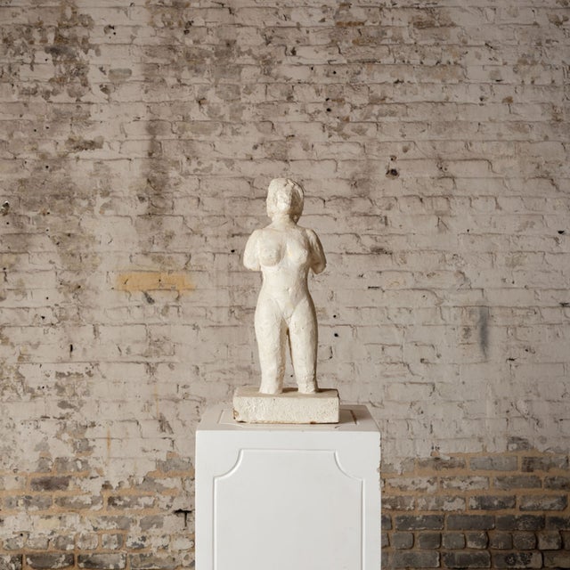 Add sculptural elegance and artistic presence to your space with this early 20th century French plaster figure statue, a...