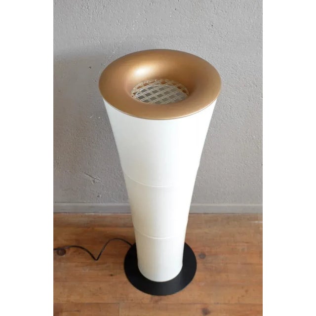 - Floor lamp in a futuristic shape with a golden shade - Column light in typical 1960s Space Age design - Made of molded...