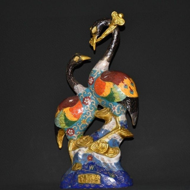 This impressive cloisonne enamel sculpture features a pair of red-crowned cranes, traditional symbols of longevity and...