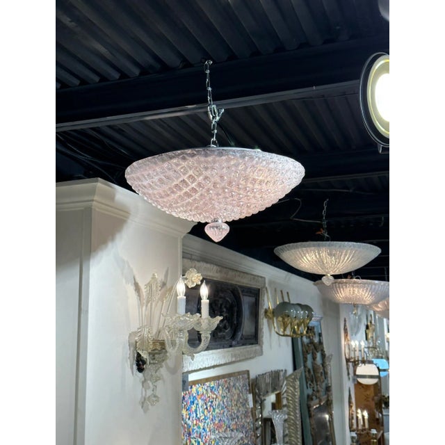 Modern Murano pink glass flush mount chandelier. Circa 2000. The chandelier has been professionally re-wired, cleaned and...