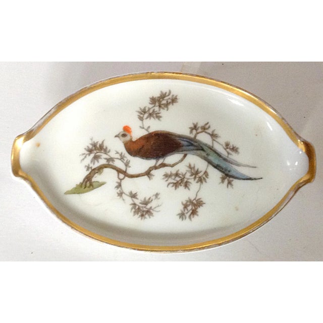 This lovely little catchall, or personal ashtray, is hand painted with a bird in a tree. Maker's mark is on the bottom of...