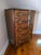 Beautiful early 20th century serpentine shaped chest of drawers with flame mahogany drawer fronts which are accented with...