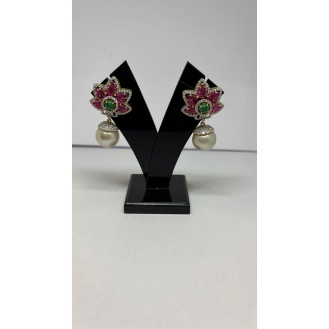 Gemstone details Diamond weight: 1.63 cts Ruby weight: 5.22 cts Emerald weight: 1 cts Pearl weight: 35.27 cts 14K gold...
