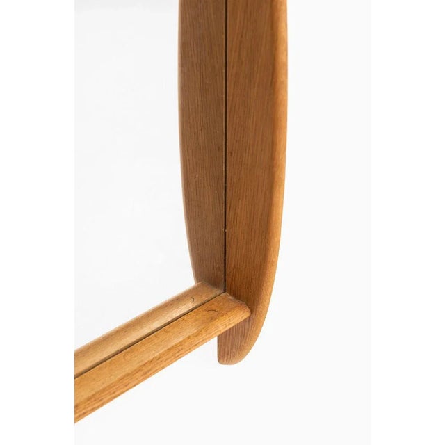 Mirror in oak by unknown designer. Probably produced in Denmark.