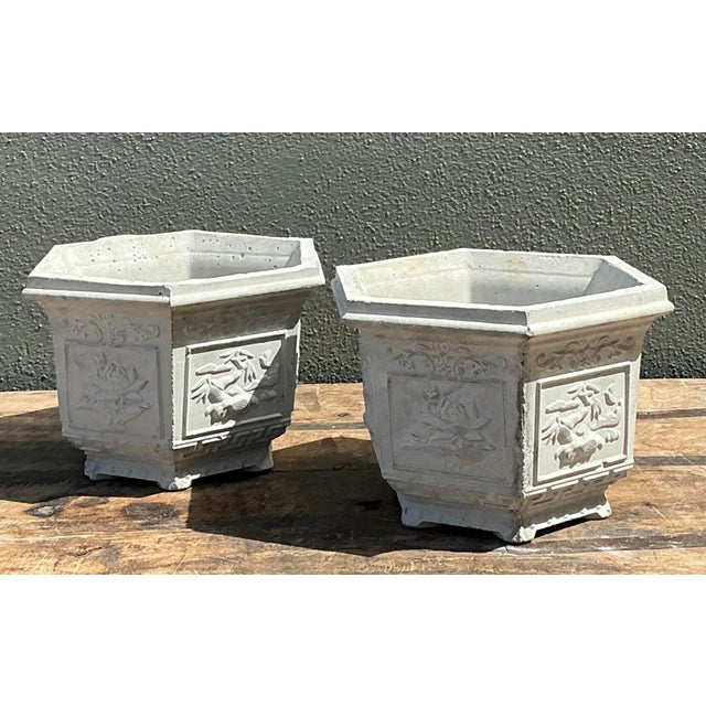 Elevate your garden or sunroom with this charming pair of vintage Chinoiserie cast concrete planters. Featuring a...