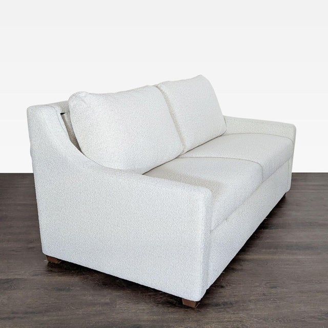 This American Leather sleeper sofa offers both style and versatility. It features a clean, modern design with soft, light-...