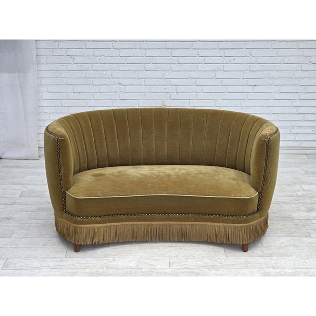 1970s, Danish 2-seater "Banana" sofa. Original green furniture velour, teak wood legs, springs in the seat. Original good...
