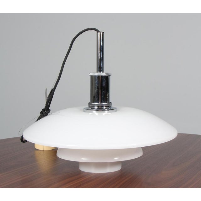 Poul Henningsen pendant lamp in chrome and opal glass. Model 4½/4, made by Louis Poulsen. This piece is attributed to the...