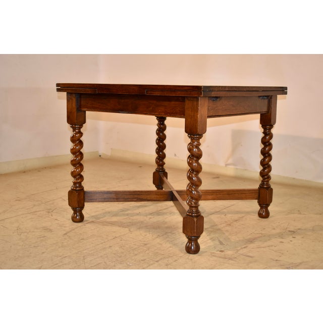 Circa 1900 period Edwardian draw-leaf oak table. The top of the table along with the two leaves are paneled and when...