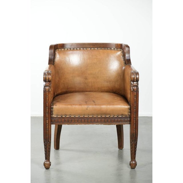 We are offering this antique armchair made of sheepskin and wood, featuring decorative nails and beautiful woodwork. This...
