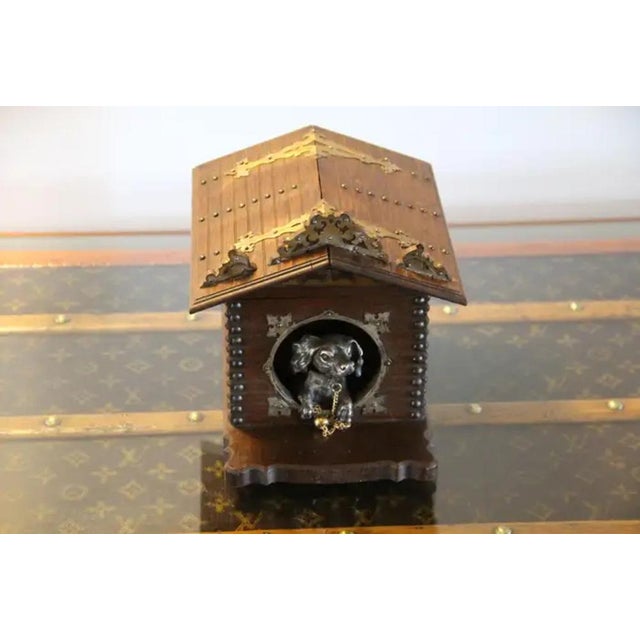 This very unusual French cigar box features a silver bronze dog wearing guarding his master's cigars.It stands at the...