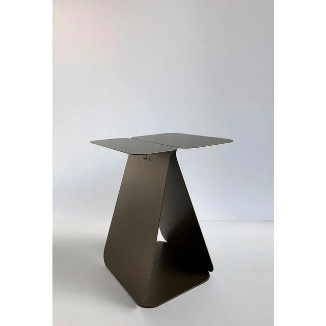 Youmy rectangular bronze table by mademoiselle jo dimensions: d 33 x w 34 x h 43 cm. Materials: bronze colored steel....