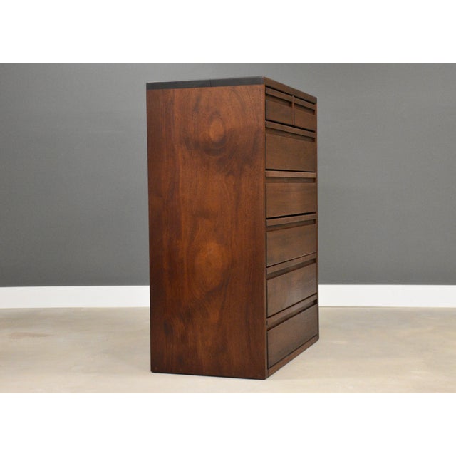 A mid century modern solid mahogany tall dresser by Montague Furnishings. Excellent original condition. One minor crack in...