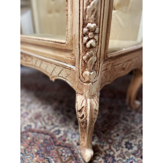 Add character and elegance to your space with this beautifully painted vintage vitrine. Featuring two glass-panelled...