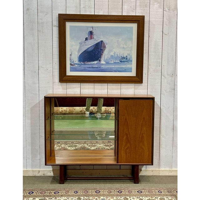 Open teak bookcase shelf with a door on the side - English work from the 70s - L=1m15, D=28cm, H=95cm.