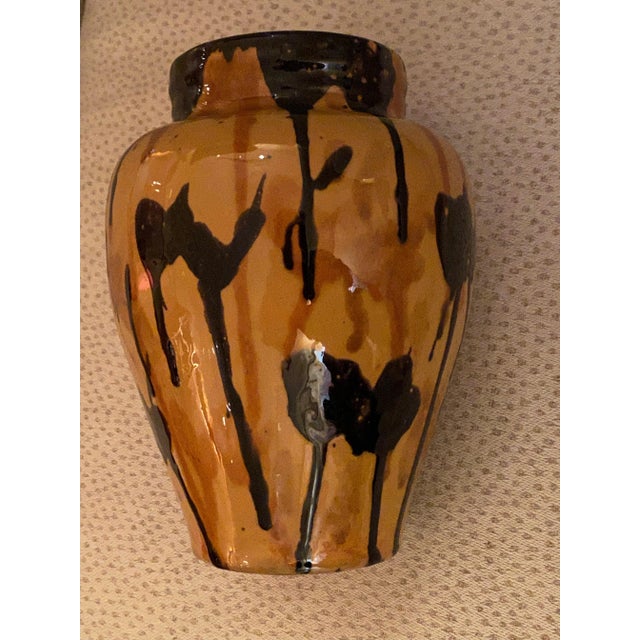 Vintage Oaxaca vase in traditional tea jar form with multicolored drip glaze drizzling down from the rim. Measures...