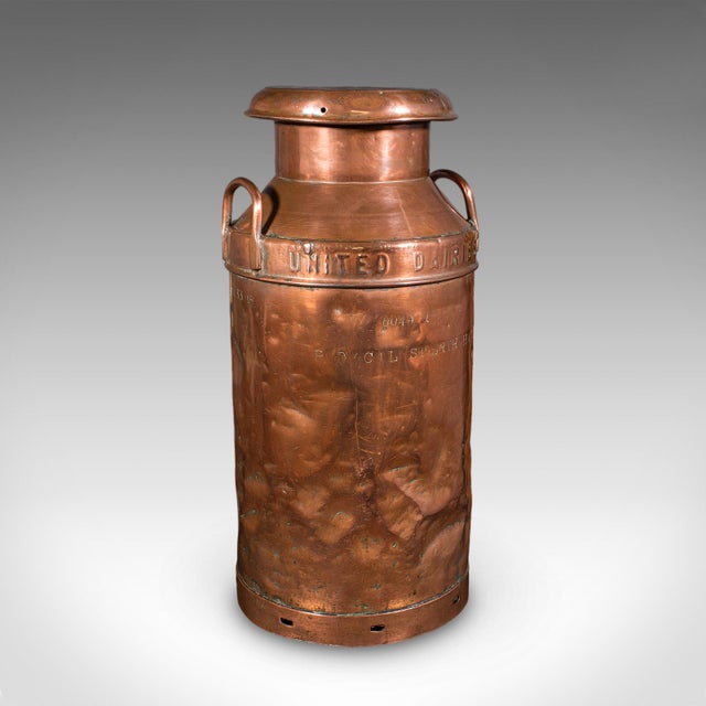 This is a vintage dairy set. An English, copper milk churn and pail, dating to the mid 20th century, circa 1950. Appealing...