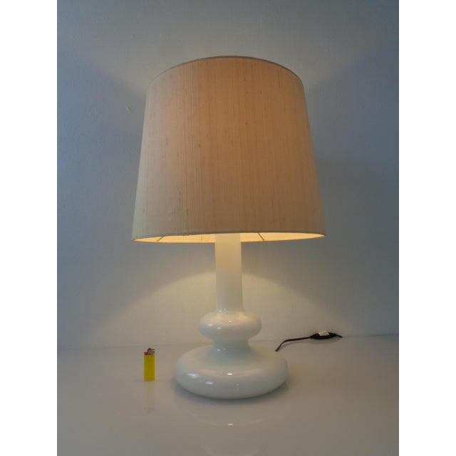 Plaza Opal glass table lamp by Hsin-Lung Lin for Holmegaard from the 1970s. This piece has an attribution mark, I am sure...