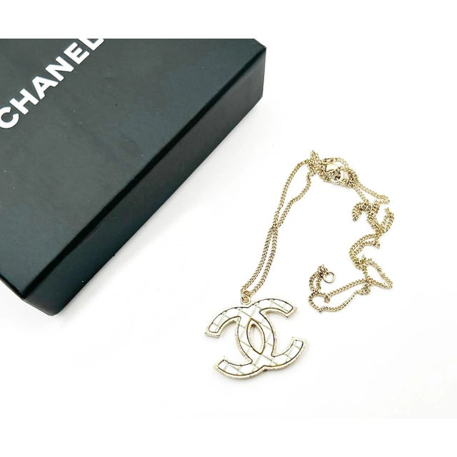 Chanel White CC Plaid Gold Frame Necklace *Marked 16 *Made in Italy *Comes with the original box and pouch -The length is...