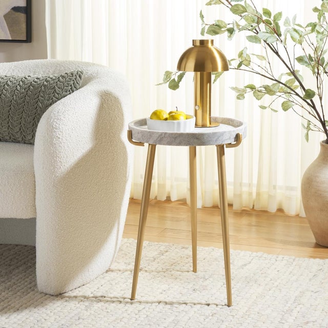 Introducing the Bonn marble side table, a sophisticated addition to any living space. This piece features a stunning blend...