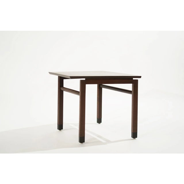 The rarely found Wedge end table designed by Edward Wormely for Dunbar, circa 1950-1959. Executed in walnut, features...
