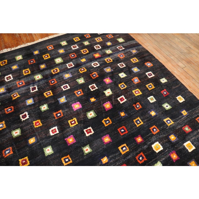 One of a kind Turkish contemporary wool rug with a colorful all-over box square pattern on a black ground. Make a splash...