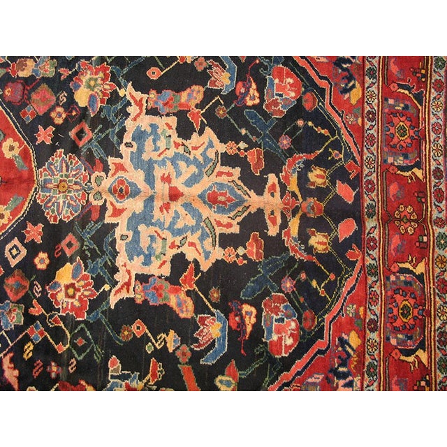 Antique Persian Bakhtiari rug 7'0" x 11'6". Antique Bakhtiari Persian Black 1930s Rug, Circa Date: 1930s. This exceptional...