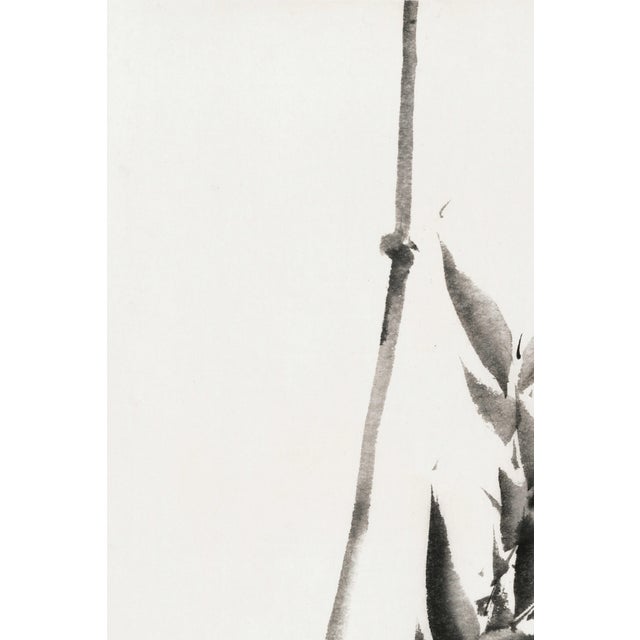 A striking example of minimalist Japanese brush painting, this vintage art print reproduction features a delicate bamboo...