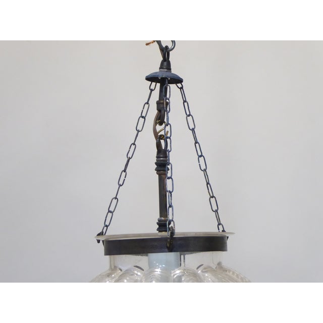 This blown glass pendant light has an etched glass design and uses an Edison base bulb up to 100 Watts.