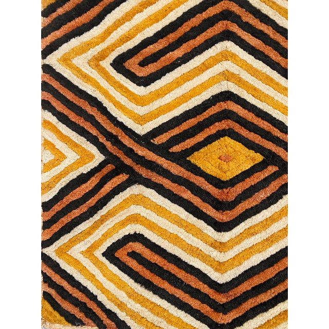 Traditional vintage Kuba grass textile handmade from the indigenous people of the Congo. Bold geometric patterns created...