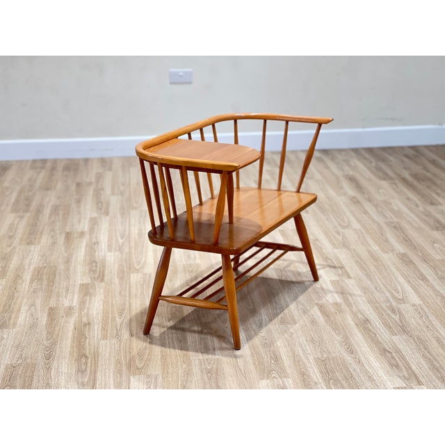 A quiet companion from a more gracious age, this Ercol telephone seat, designed by Lucian Ercolani and made in England in...