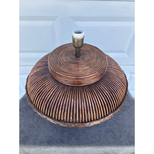 Beautiful and unique pencil reed lamp. Large clay pot with a thick dark brown coating on it. Then expertly wrapped in cane...